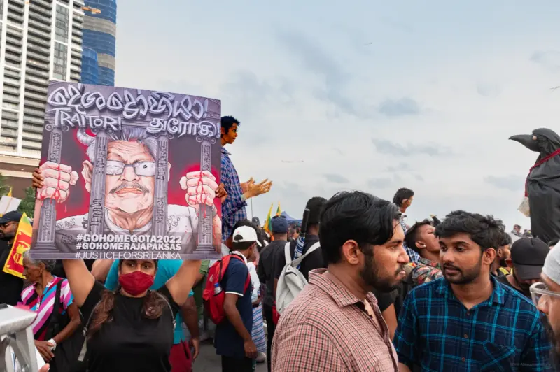 A girl holding a placard at the artist's protest during the Sri Lankan uprising of 2022